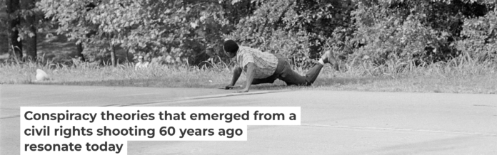 James Meredith looks at Aubrey Norvell, partially hidden behind foliage, after Norvell shot him in Hernando, Miss., on June 6, 1966. AP Photo/Jack Thornell